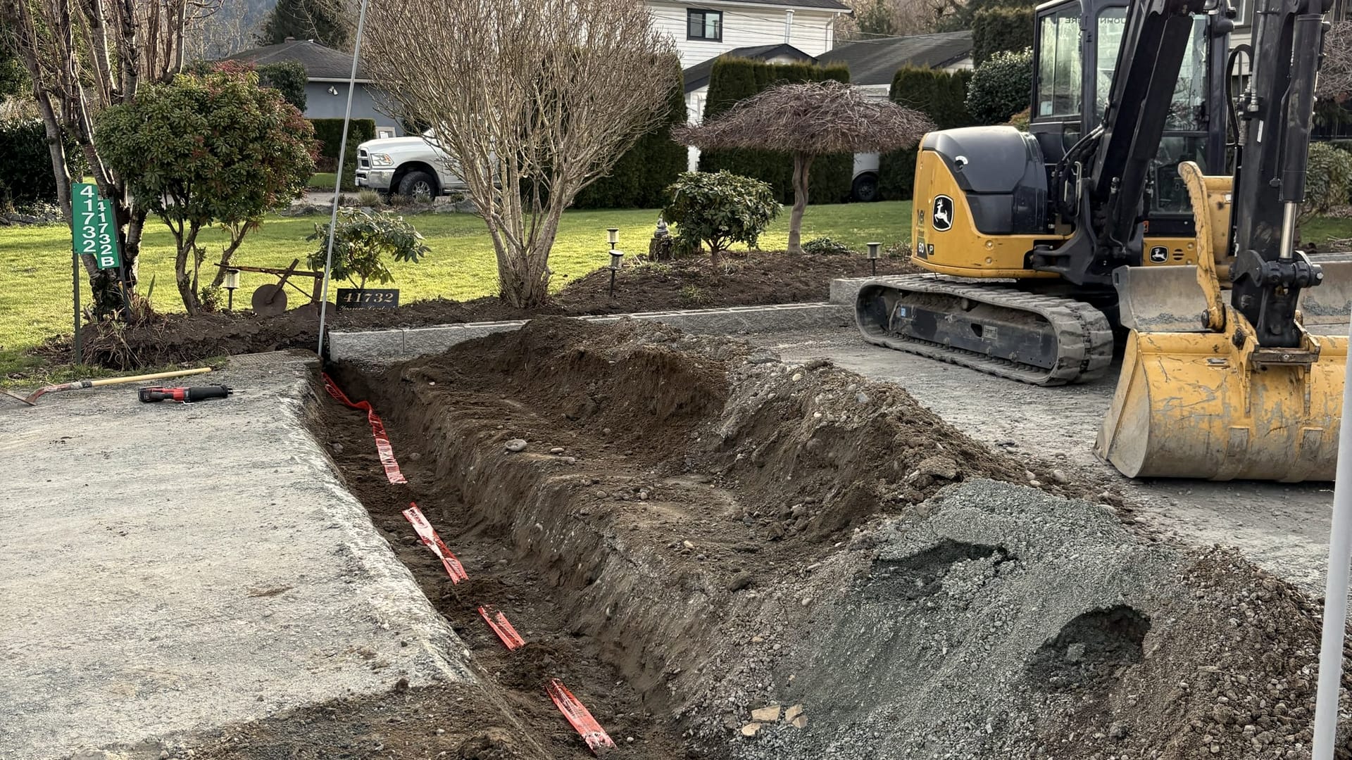 A Fraser Valley property with mountains behind, ready for landscape work